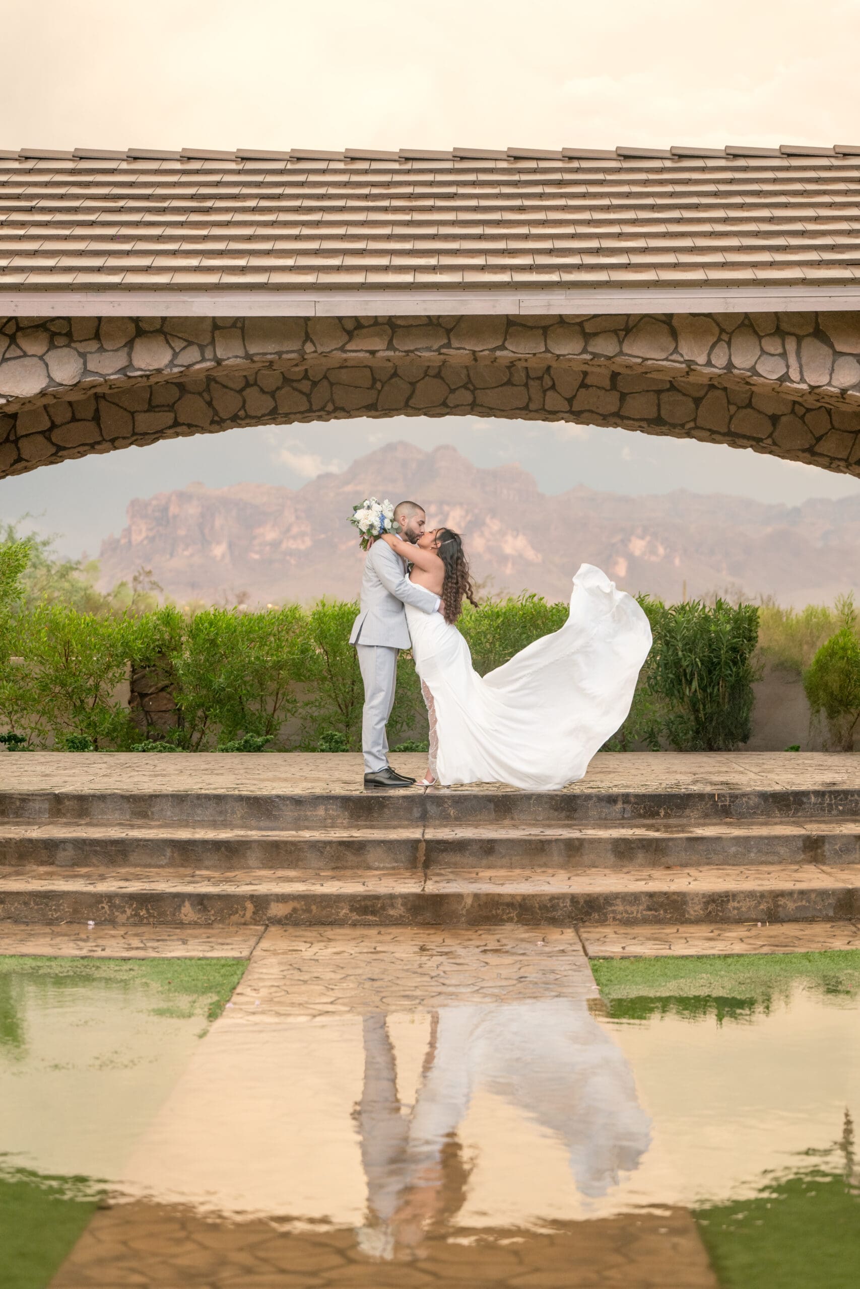 Couple Kissing with Superstition Mountain Backdrop