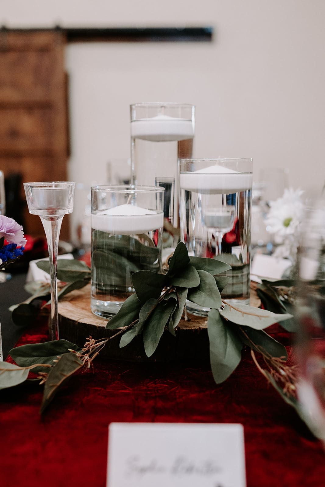 Clear candles with black and red accent centerpeices