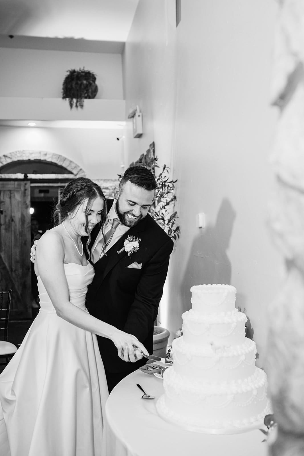 Bride and groom cutting their cake