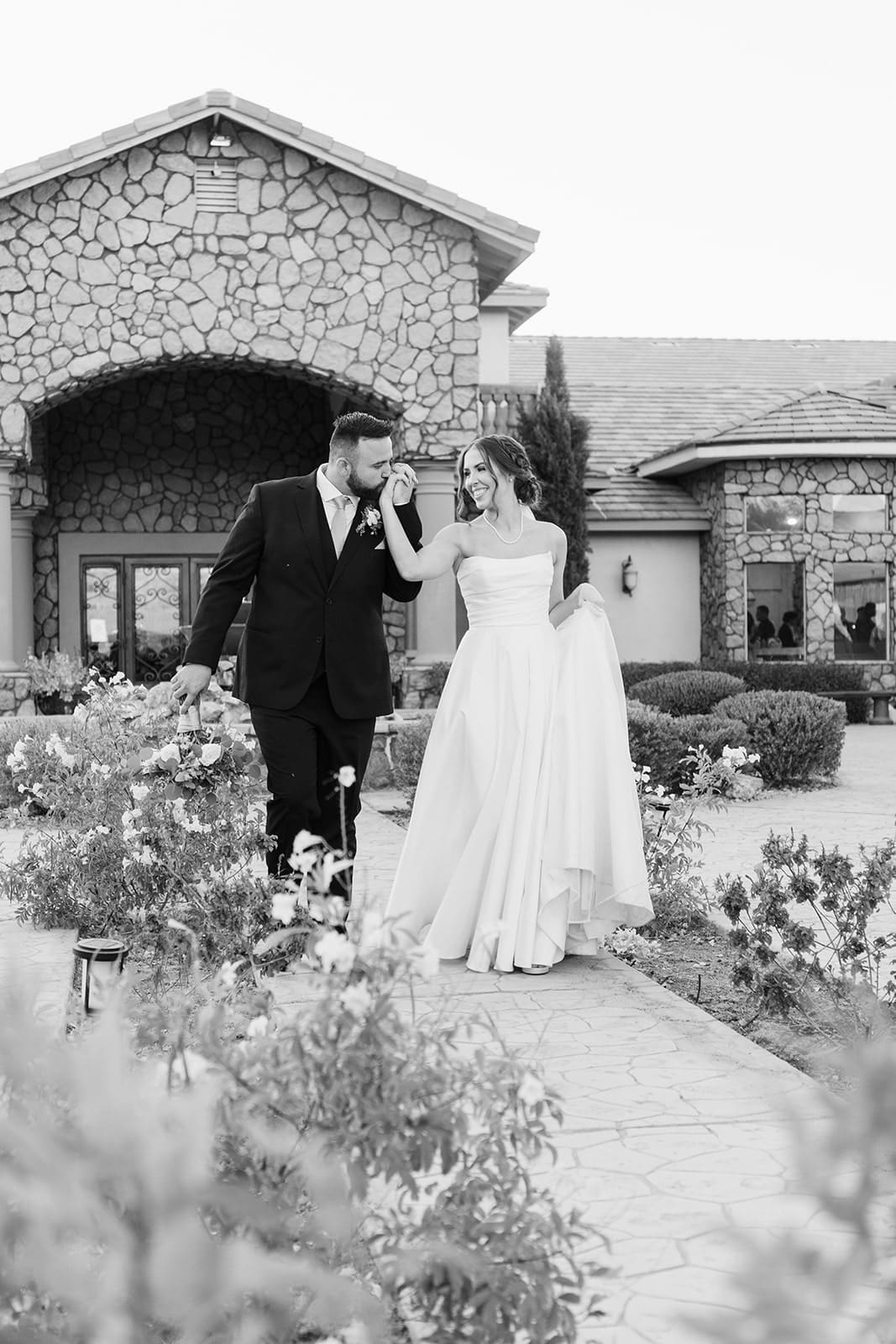 Bride and Groom in front of superstition manor