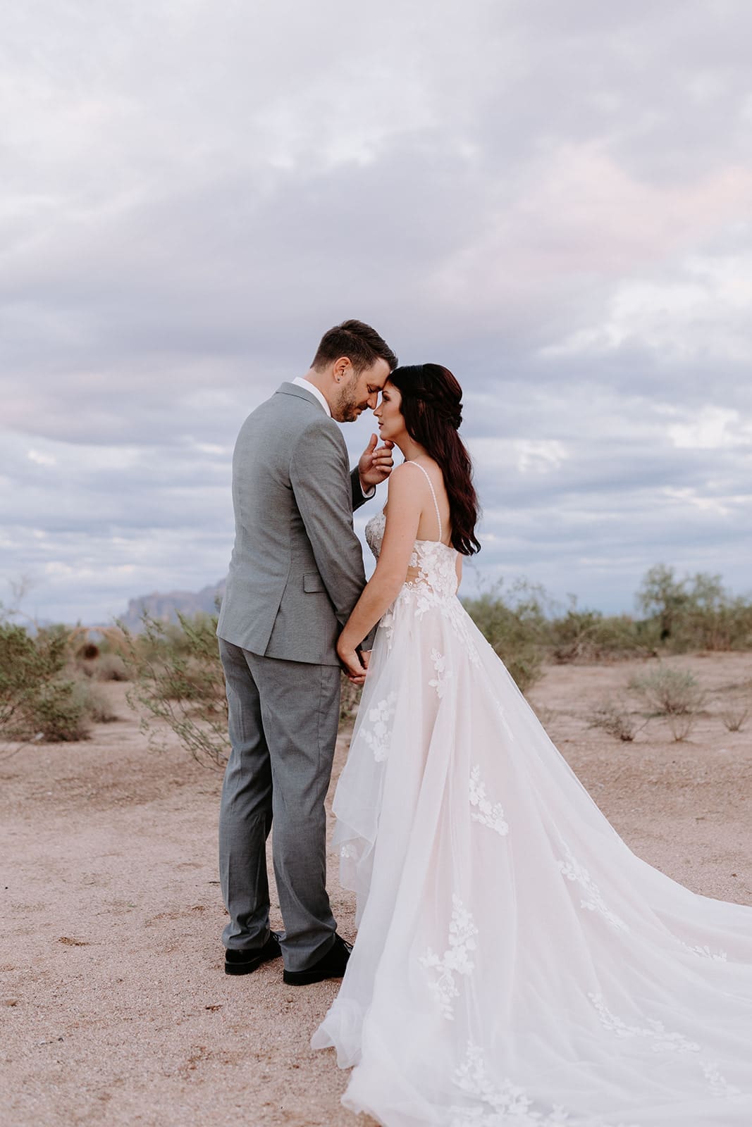 Bride and groom with superstition mountain backdrop
