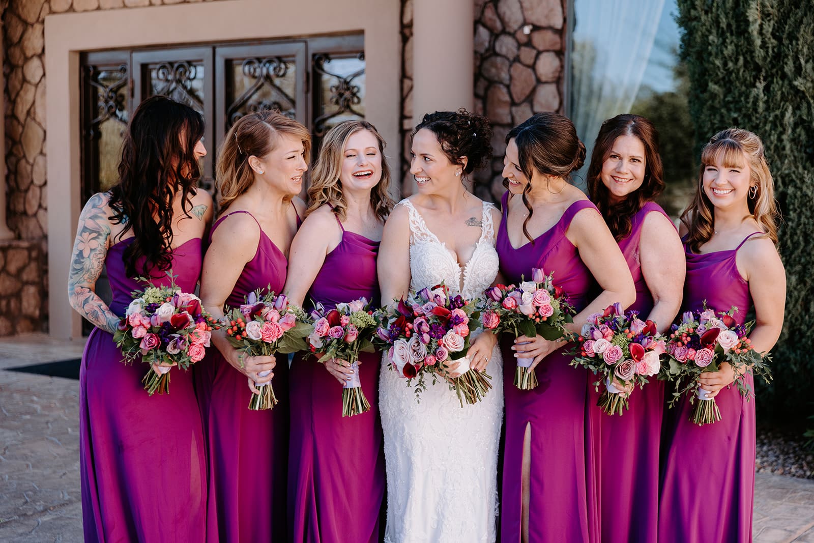 Bridal party and bride with purple gowns