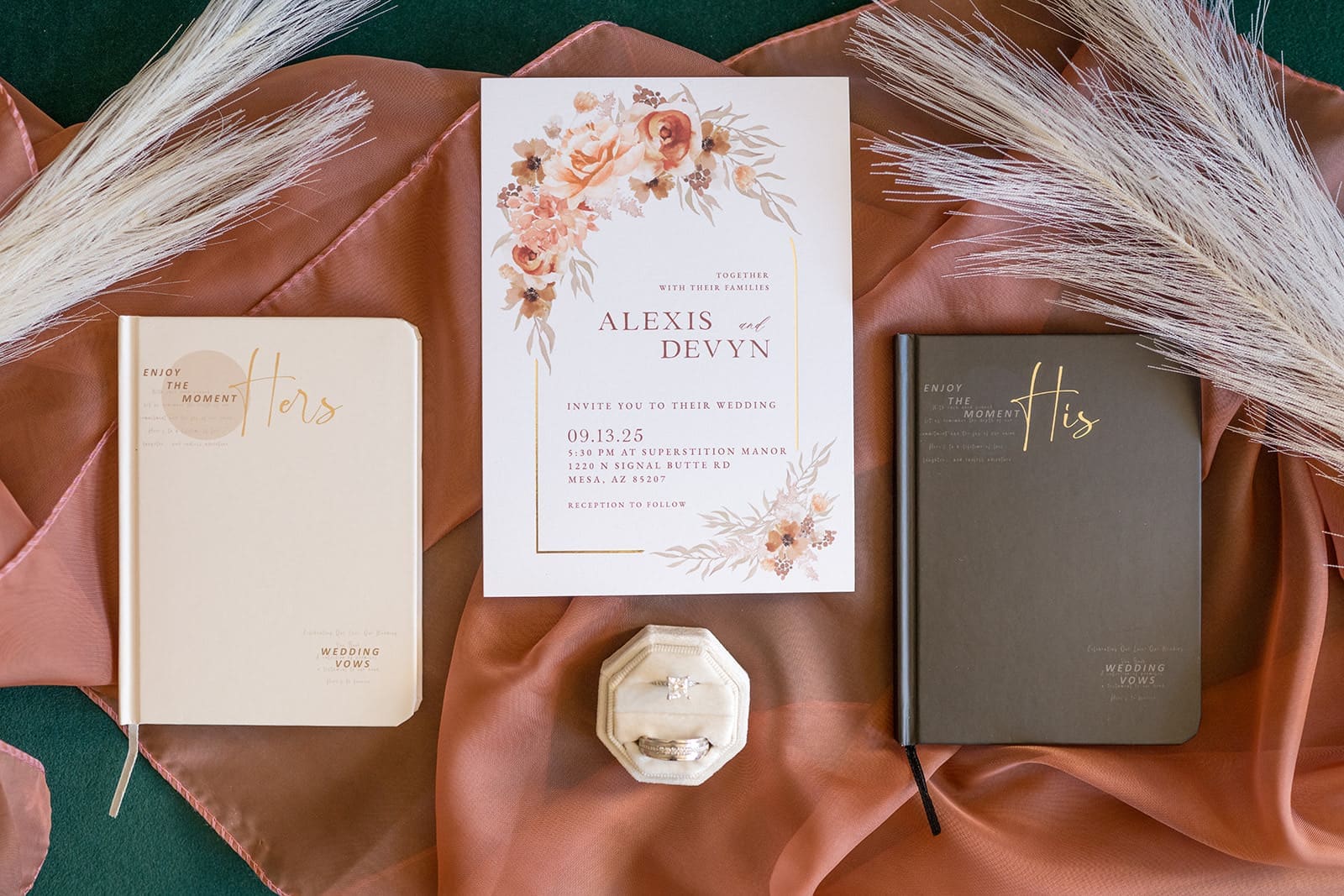 Flat lay photo of invitation and vows with rings