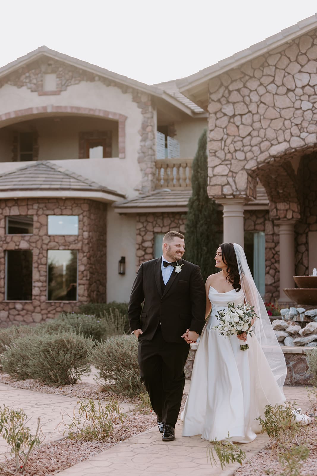 Bride and groom on Superstition Manor Grounds