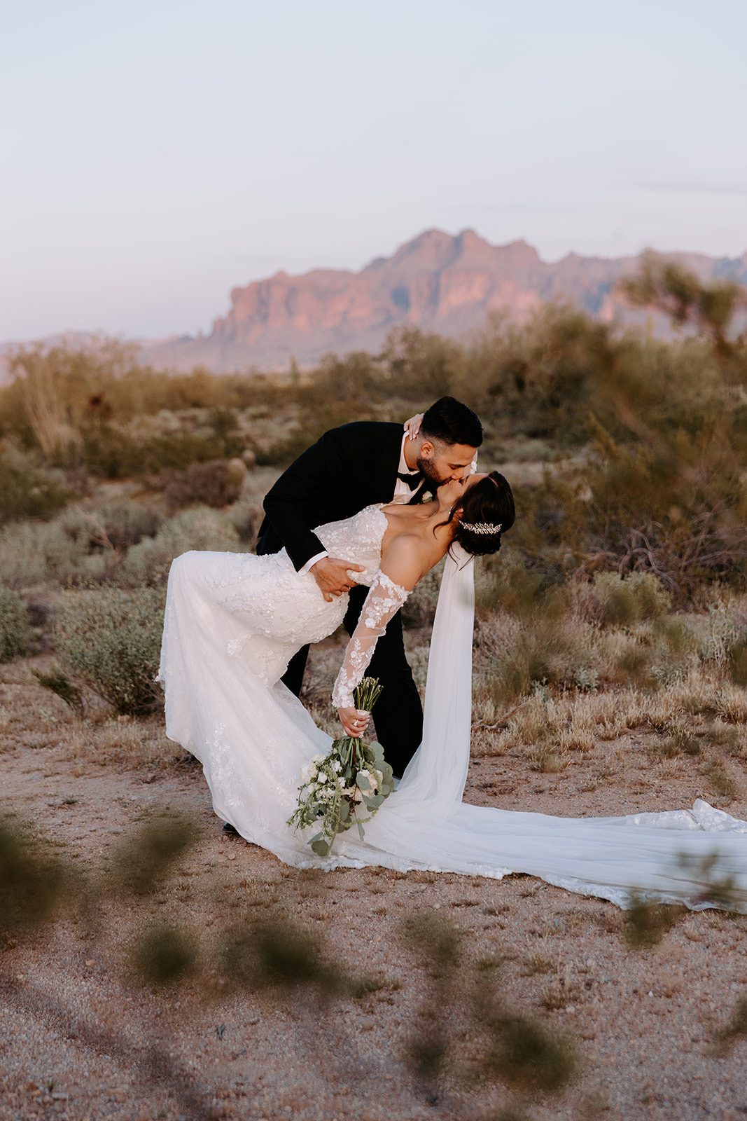 Bride and groom with superstition mountain backdrop