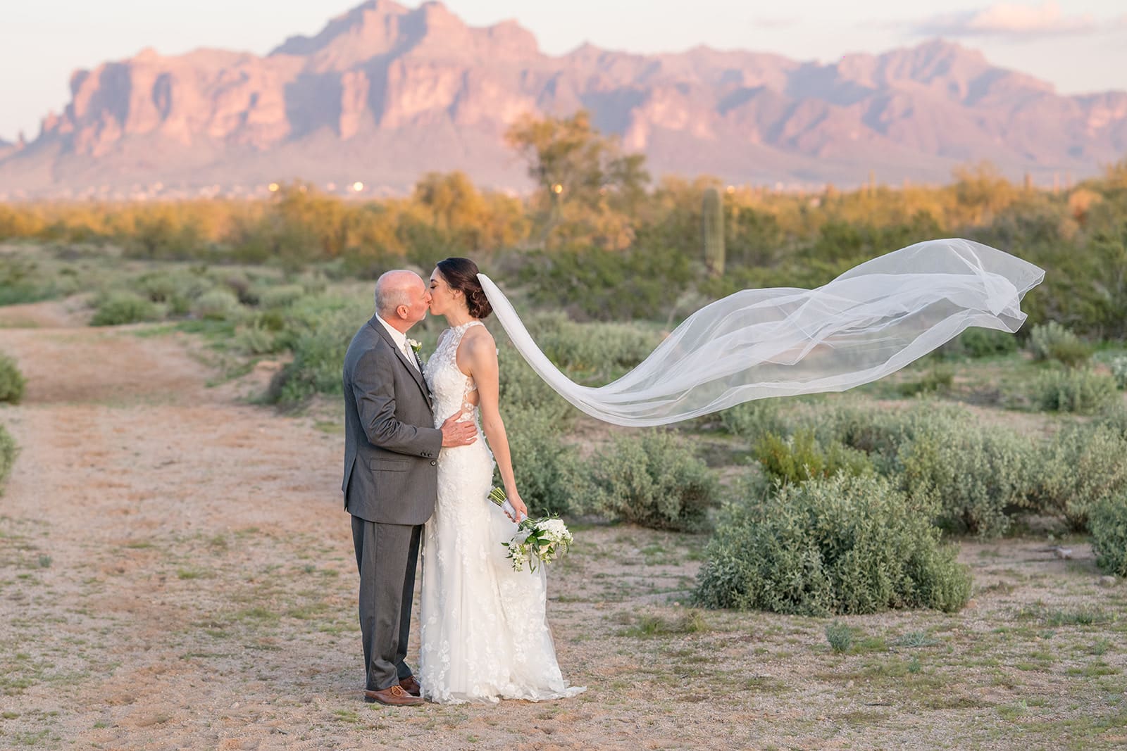 Bride and groom with superstition mountain backdrop 