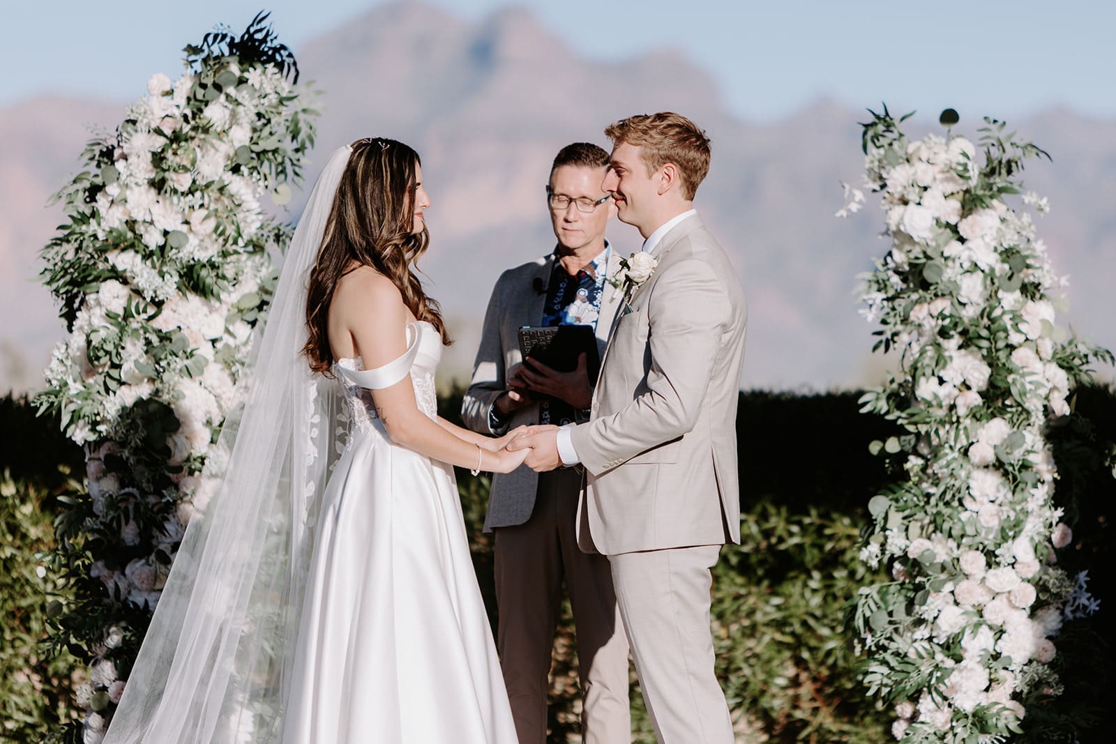 Bride and groom at altar at superstition manor