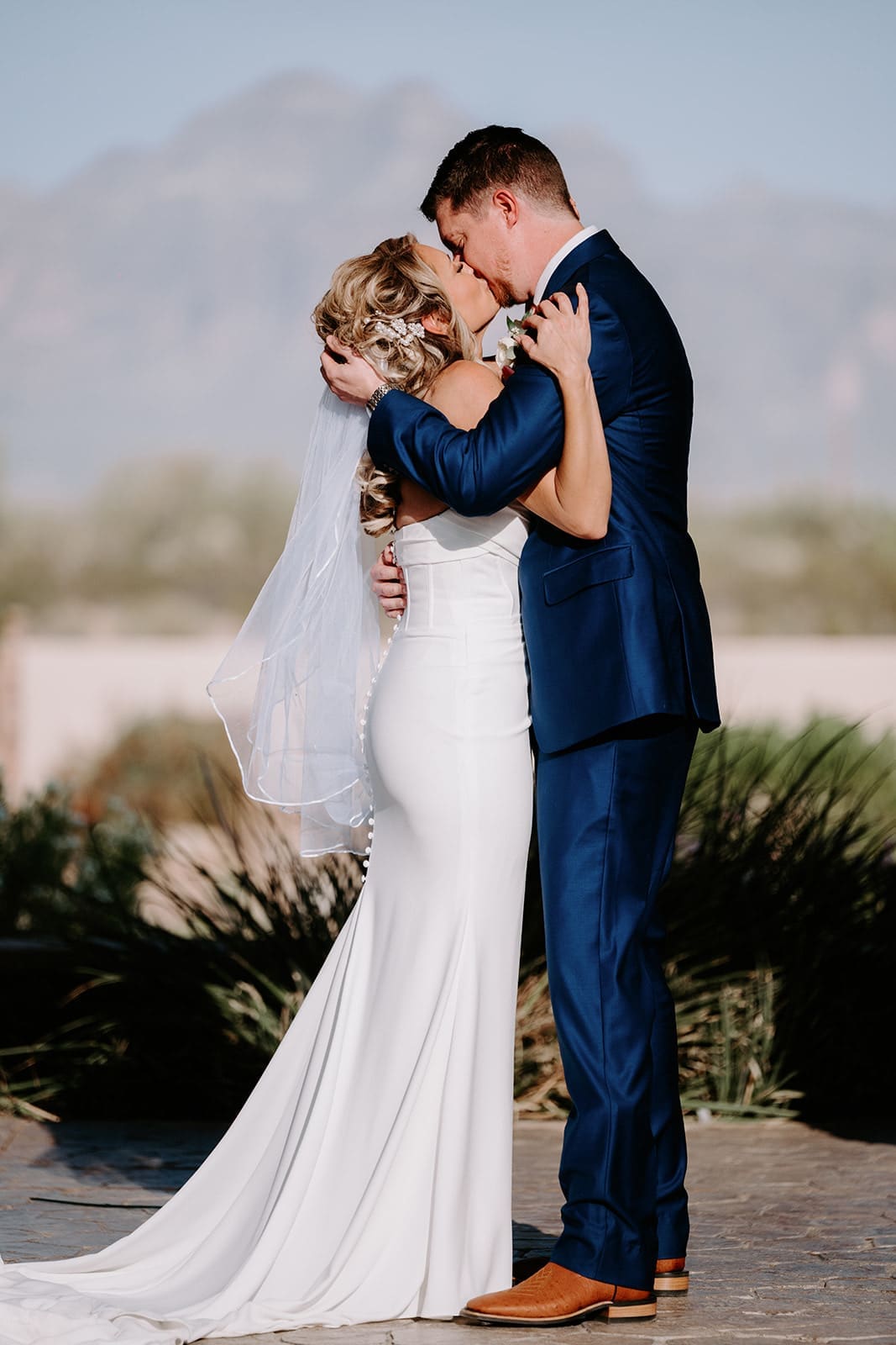 Bride and groom ceremony kiss at superstition manor 