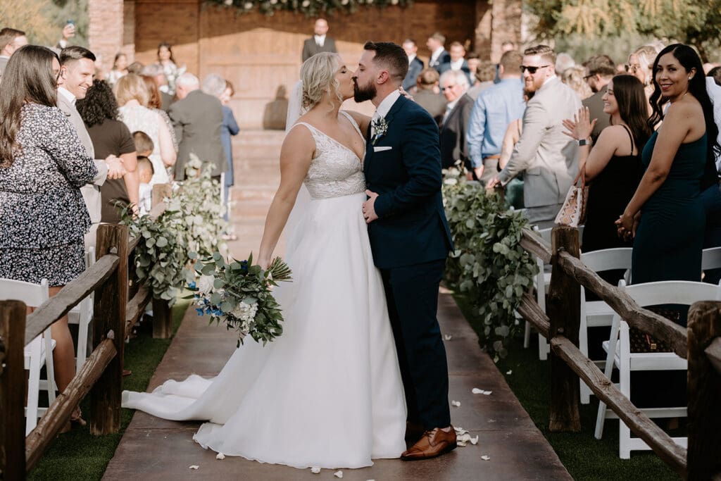 Bride and groom kiss at superstition manor 