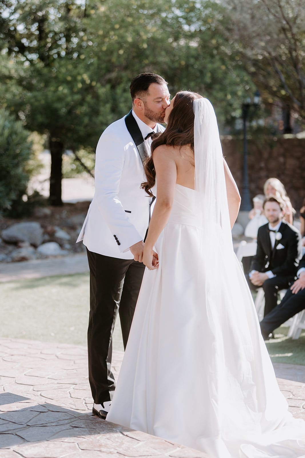 Bride and groom ceremony kiss