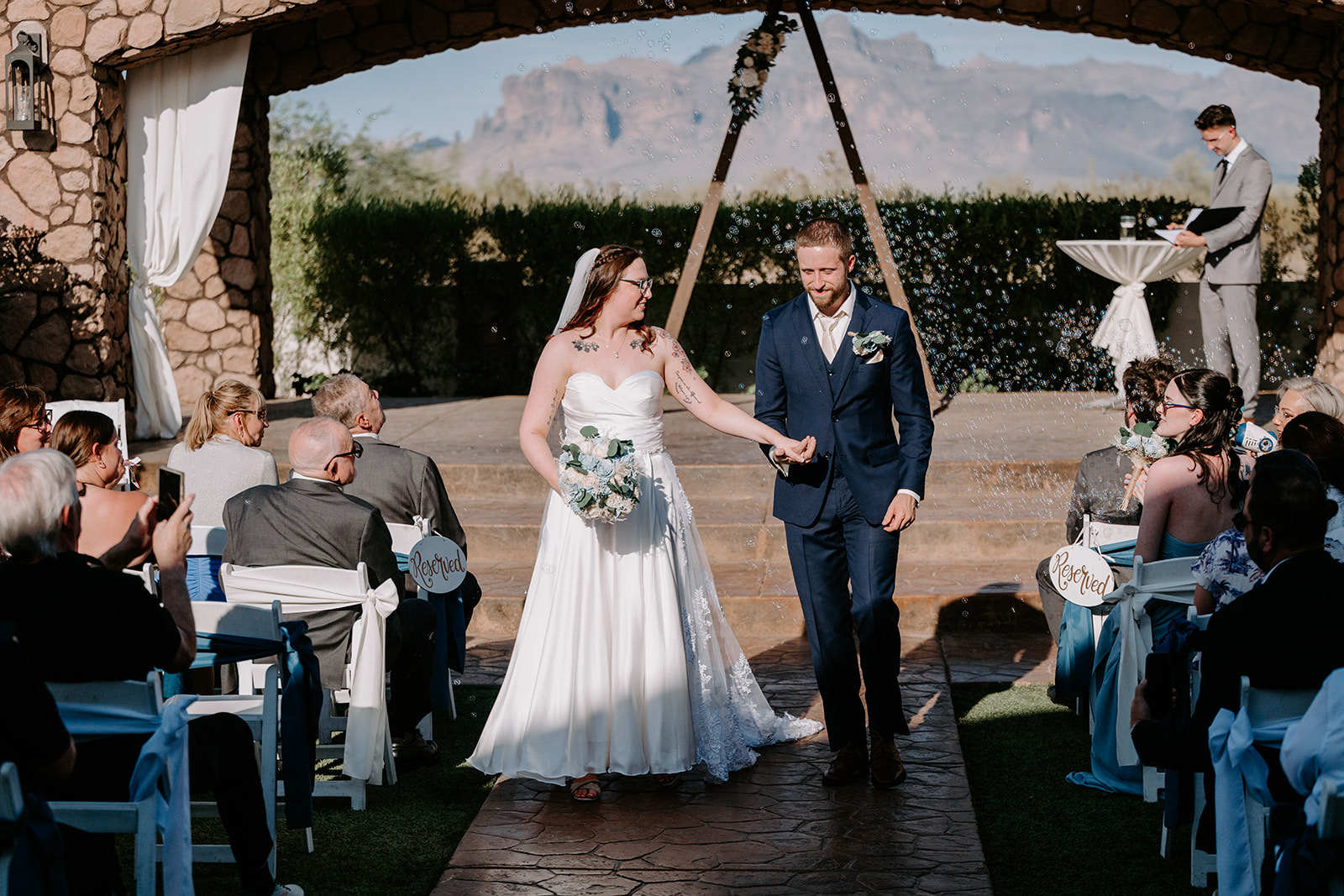 Bride and groom walking down altar 