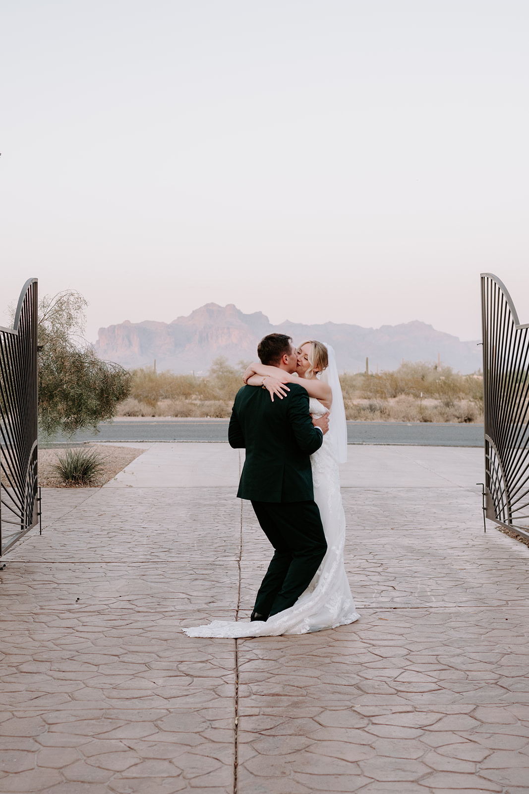 Bride and groom on superstition manor grounds 