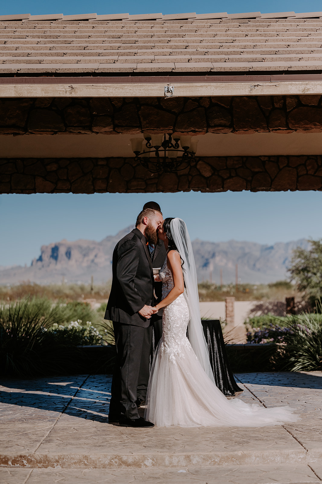 Bride and groom kiss 