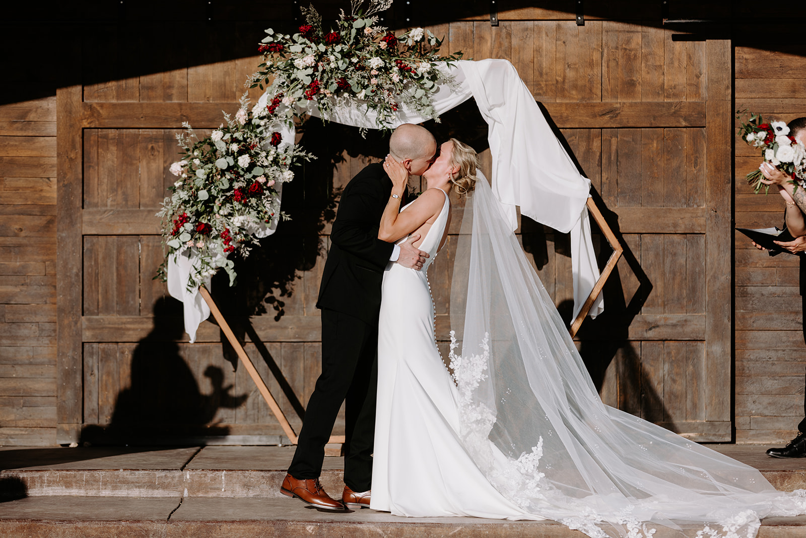Bride and groom ceremony kiss