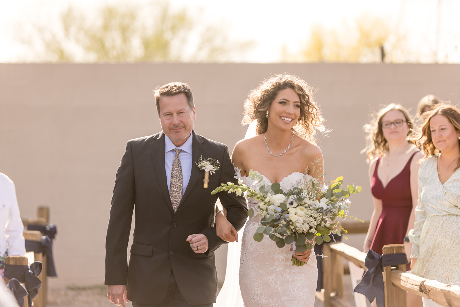 Father and bride walk down aisle