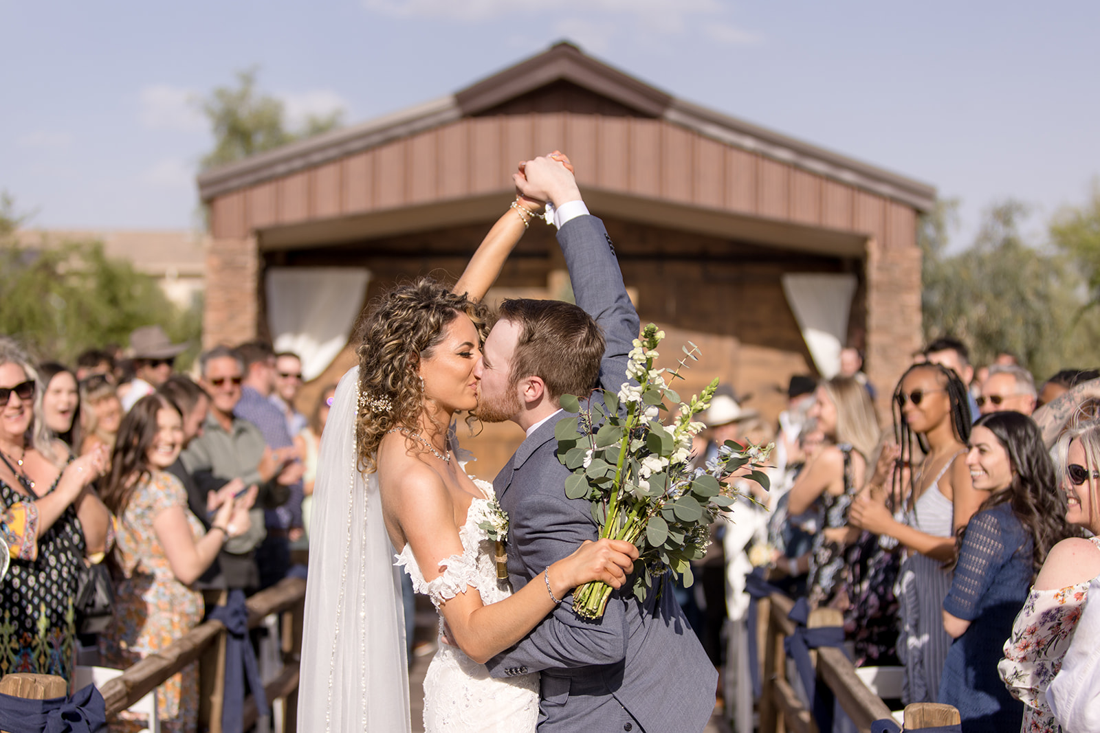 Bride and groom ceremony kiss